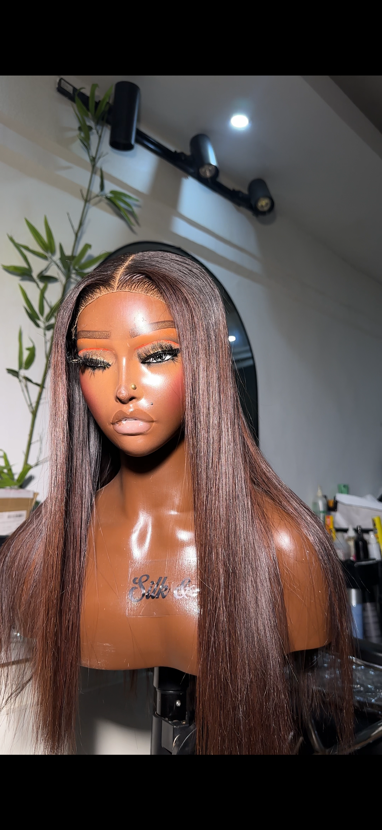Stylist crafting a custom wig at Silk & Strands